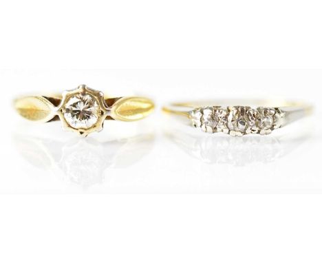An 18ct yellow gold ring set with a diamond, size M, and an 18ct yellow gold ring set with three small diamonds, size P, comb
