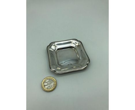 A 800 Grade Continental silver tray. Measures 0.5x7x7cm 