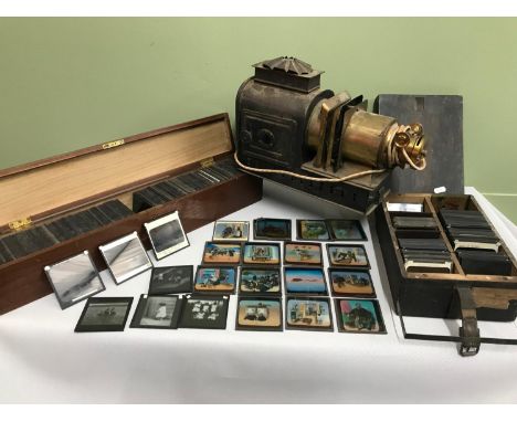 A Victorian Magic Lantern together with two crates of slides which includes Tippo: A tale of a tiger slides by G.W.W. 