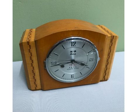 A Vintage 'Hero' Jiangsu China mantel clock, In a working condition. 