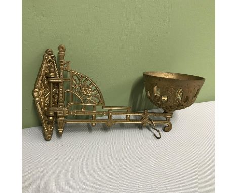 A Victorian cast metal ornate wall paraffin lamp bracket. 