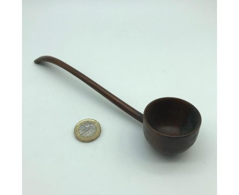 A 18th century hand carved wooden ladle. Measures 20cm in length 