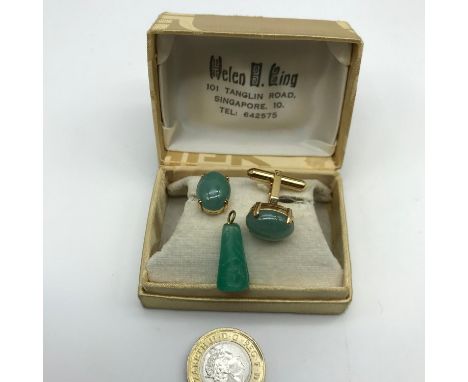 A Pair of 14k gold &amp; jade Singapore cuff links together with jade carved pendant. Cuff links weigh 8.74grams 