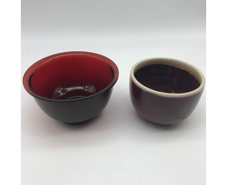 A 19th century Chinese ruby glass drinking cup together with pottery saki cup (20th century)