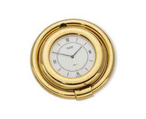 Case: gilt brass, numbered ‘HD 4909 Q 63’Dial: white, diameter 4 cm (total circa 6 cm), signed ‘VAN CLEEF & ARPELS’, baton ho