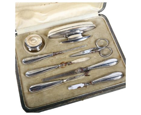 An Art Deco 8-piece vanity set in fitted case