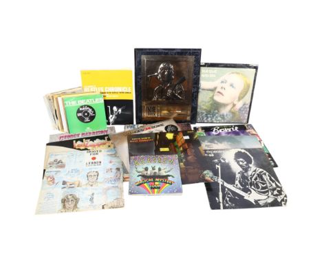 A quantity of vinyl LPs and 7" singles, mostly Beatles related in nature, but including artists such as Led Zeppelin, David B