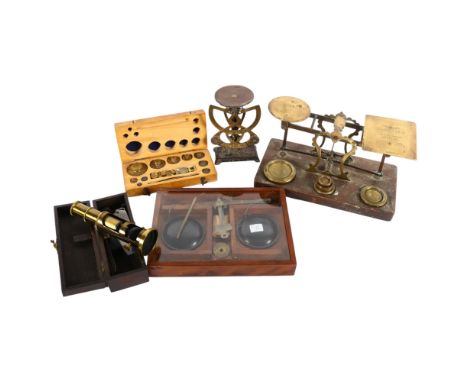 A Victorian brass postal scale and weights, on oak base, L26cm, a cased balance scale with a set of Griffon &amp; George boxe