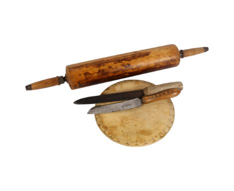 A selection of Antique kitchenalia, including an oval hardwood breadboard, diameter 24.5cm, a substantial wooden rolling pin,