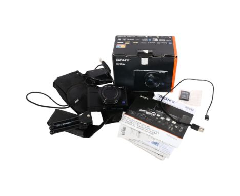 A Sony RX100 IV CyberShot digital camera, in original box with associated instruction manual and accessories