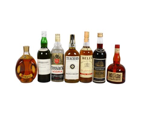 A collection of spirits, including a bottle of Dimple Scotch Whisky, a bottle of Laphroaigh Isle Malt Scotch Whisky, a bottle