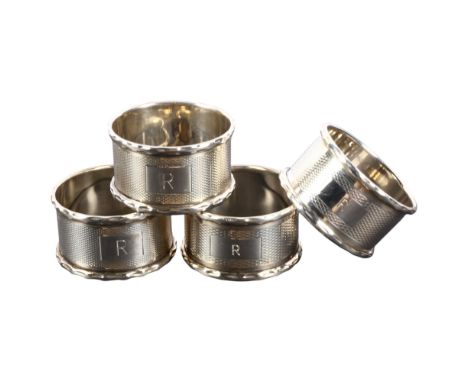 4 engine turned silver napkin rings, all monogramed R