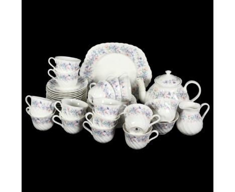 A Wedgwood bone china part tea service "Angela" pattern, containing 14 teacups, 15 saucers, 12 side plates, sugar bowls, milk