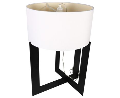 A stylish black painted table lamp, the X form base supporting a white shade, height overall 60.5cm   