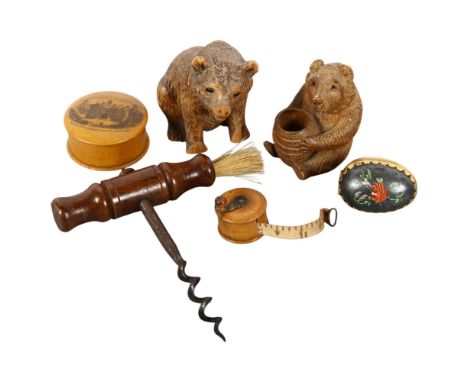 A group of interesting items, to include a miniature boxwood fishing reel design tape measure, a Mauchline Ware tape box (no 