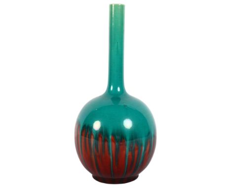 A Burmantofts green and red glazed bottle vase, marked to base "107", H24.5cm, item from the estate of a former Manager and c