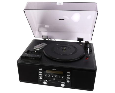 A TEAC LP-R500 stereo system with record deck, instruction manual and associated cables