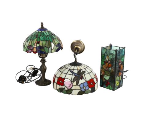 A group of Tiffany style table and ceiling lamp fittings, including an oval pendant light fitting, with dragonfly and floral 