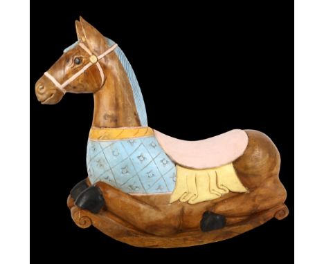 A large carved hardwood model of a kneeling rocking horse, length approx 62cm, height 61cm