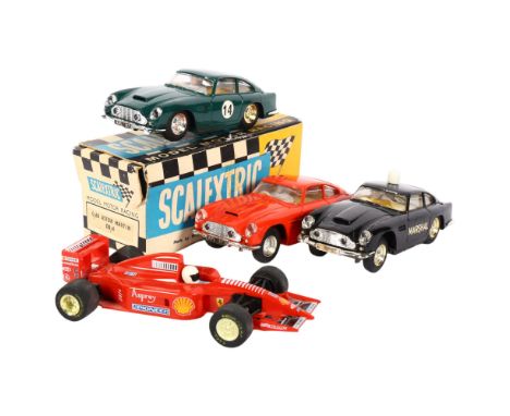 A group of Vintage Scalextric vehicles, including Aston Martin DB4 Marshall Control vehicle, Tri-ang Scalextric model Motor R