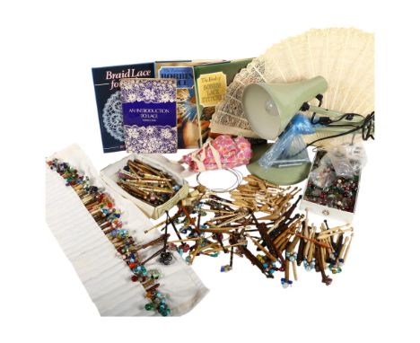 Lace bobbins, anglepoise lamp, fan, books on lacework, etc
