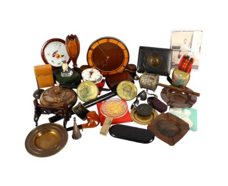 A box of items, including a prayer wheel, card case, lamp, clock, etc