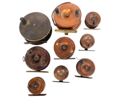 A group of Vintage salmon and other fishing reels, including a 4" brass reel with ratchet, and 8 other wooden reels