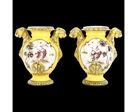 A pair of early 19th century Italian Maiolica jars, decorated with manganese yellow and copper green, each with panels depict