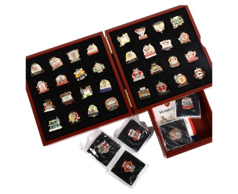 A cased Arsenal FC Victory pin collection, comprising 32 enamelled pin badges plus 5 Community Shield and FA Cup badges, fitt