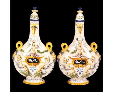 A pair of Ginori late 19th century Italian Maiolica pilgrim flasks, each with satyr masks to the shoulders, shoulders with sc