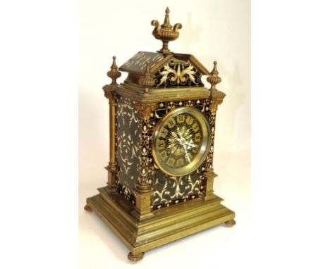 A decorative Victorian mantel clock in enamelled brass case, having two train movement hour and half hour striking on a gong,