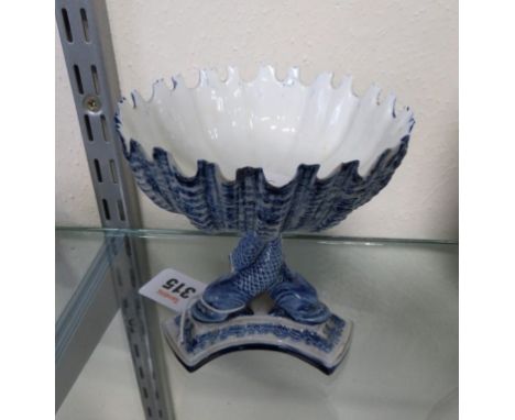 A Royal Worcester shell bon bon dish on entwined dolphin supports 