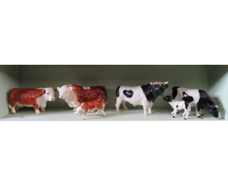 Glazed ceramic Hereford bull, cow & calf and similar Friesan bull, cow and calf 