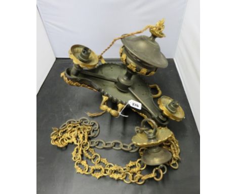 A decorative bronzed and gilt metal three branch pendant ceiling light fitting with suspension chain 