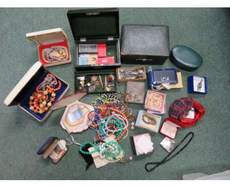 A large quantity of assorted costume jewellery, including brooches, plastic beads, pearl necklace, hat pins, three 9ct gold b