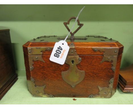 A late 19th Century brass bound oak tea caddy 