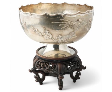 Chinese export silver bowl decorated with a raised pattern of birds and trailing prunus on a matt ground with crimped rim and