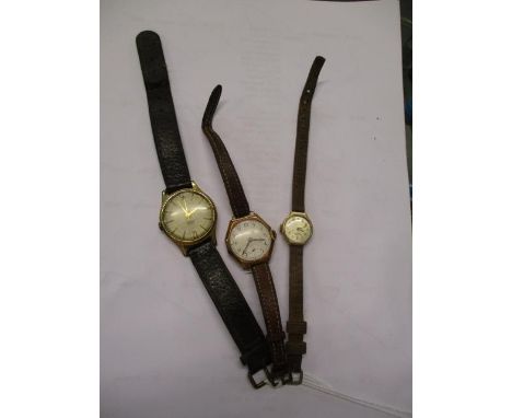 A Rotary 9ct gold cased ladies wrist watch, another 9ct gold cased wrist watch on a leather strap and a vintage Smiths gents 