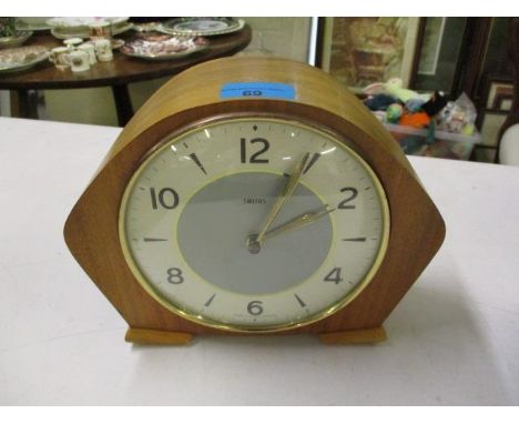A 1950s walnut cased mantle clock 