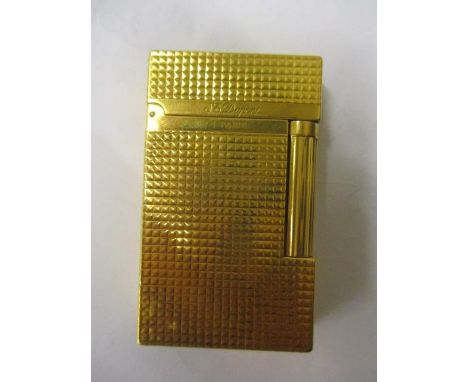 A gold plated DuPont lighter 