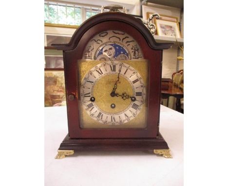 A reproduction mahogany cased mantle clock 