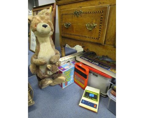 A mixed lot of children's games to include Supermarket Sweep, Ker Plunk, Game of Life, Lego, Caveman game, Speak & Spell and 