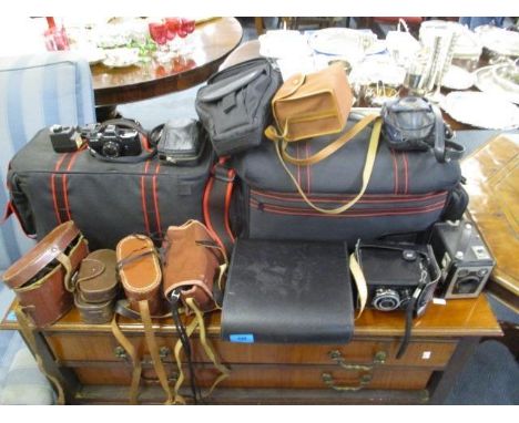 A selection of cameras and binoculars to include a Lubitel 2, a Brownie six-20 D, camera equipment and other items 