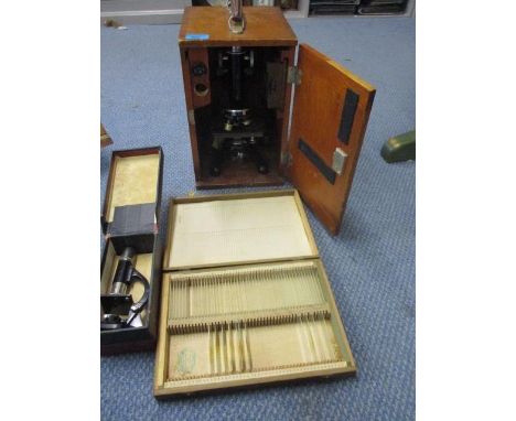 A Beck microscope in a wooden case, a smaller students microscope and mixed slides 