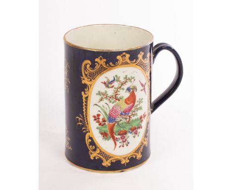 A Worcester mug, painted two oval reserves of exotic birds within flowering branches with gilt scroll surrounds, blue crescen