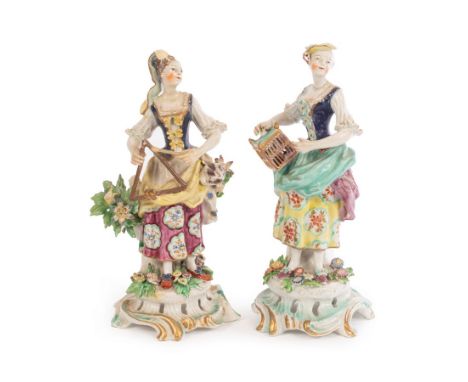 A Bow figure of a lady emblematic of marriage holding a cage, another playing the triangle, both on turquoise and gilt scroll