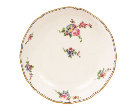 A Sèvres dessert dish, dated 1763, of Compotier Rond Gauffré shape, the saucer dish finely moulded with overlapping flower pe