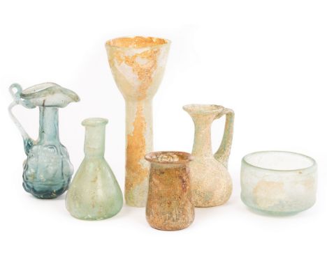 A selection of Roman glass, 1st-4th Century AD, all in pale green glass, comprising a small bowl, 5.7cm diameter, a conical u