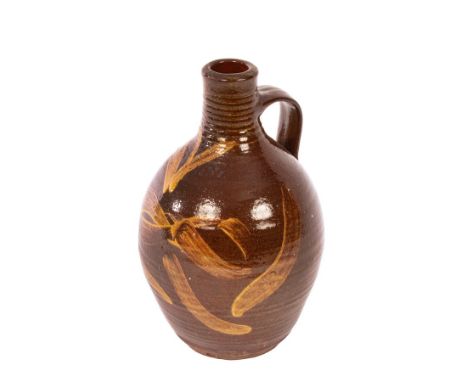 Michael Cardew (1901-1983), a slipware wine flagon made at Winchcombe Pottery, circa 1938, of ovoid bottle shape with a groov