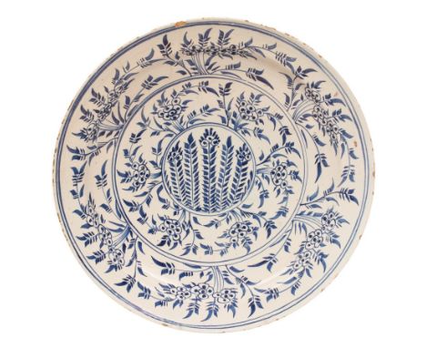 A large Wincanton Delftware circular dish, circa 1730-50, painted in blue with the Mimosa pattern, 35cm diameter/Provenance: 